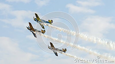 Aerobatic airplane pilots training in the sky of the city Bucharest, Romania Editorial Stock Photo