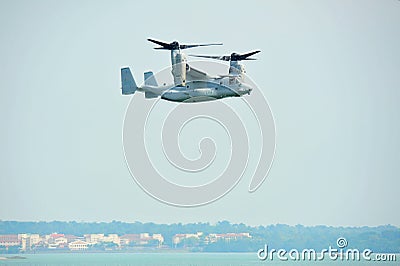 Aerobatic flying display by US Air Force (USAF) MV-22 Osprey tilt-rotor aircraft at Singapore Airshow Editorial Stock Photo