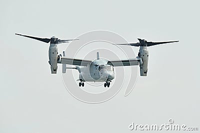 Aerobatic flying display by US Air Force (USAF) MV-22 Osprey tilt-rotor aircraft at Singapore Airshow Editorial Stock Photo