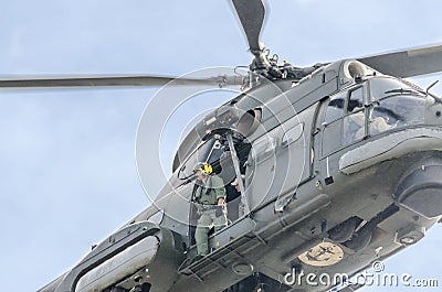 Aerobatic helicopter pilots training in the sky of the city. Puma elicopter, navy drill. Aeroshow Editorial Stock Photo