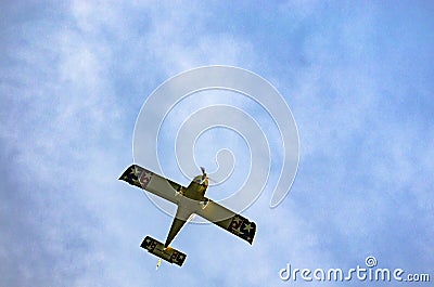 Aerobatic plane flying high in the sky Stock Photo