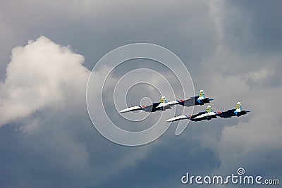 Aerobatic team Russian Knights at air show. Cloudy sky in the ba Editorial Stock Photo