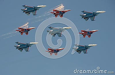 Aerobatic team `Swifts` and `Russian knights` aircraft `su-30cm and MiG-29` made the salute during a rehearsal of the Victory para Editorial Stock Photo