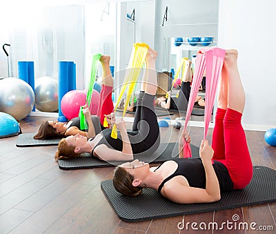 Aerobics pilates women with rubber bands in a row Stock Photo