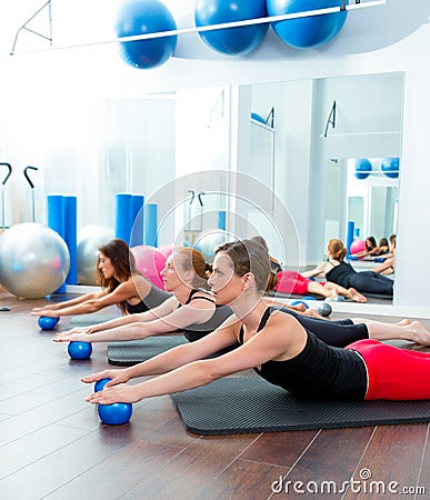 Aerobics pilates women with toning balls in a row Stock Photo