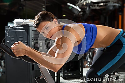 Aerobics spinning monitor trainer woman at gym Stock Photo