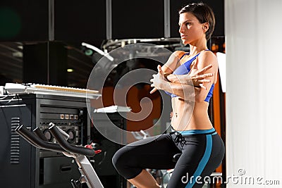 Aerobics spinning monitor trainer woman stretching Stock Photo