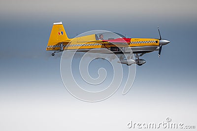 Aeroclub of Romania performing aerial acrobatics at BIAS 2023, Extra 330SC plane. Editorial Stock Photo