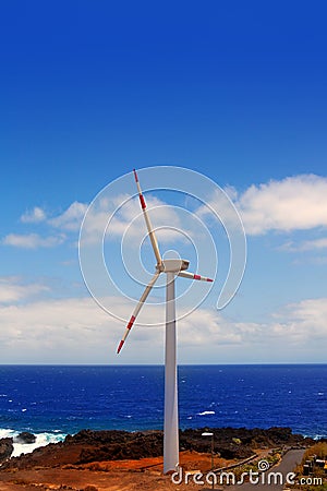 Aerogenerator windmills in front of ocean sea Stock Photo