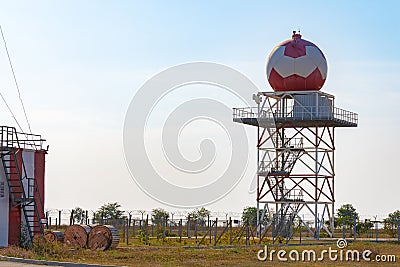 Aeronautical meteorological station tower with spherical radar at airport Stock Photo