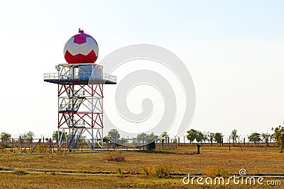 Aeronautical meteorological station tower with spherical radar at airport Stock Photo