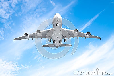 Aeroplane flying in the blue sky Stock Photo