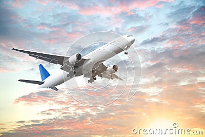 Aeroplane flying in sunset sky with beautiful cloud Stock Photo