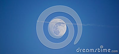 Aeroplane in front of the blue moon Stock Photo