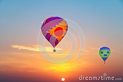 Aerostatic Balloons flying at sunrise Stock Photo