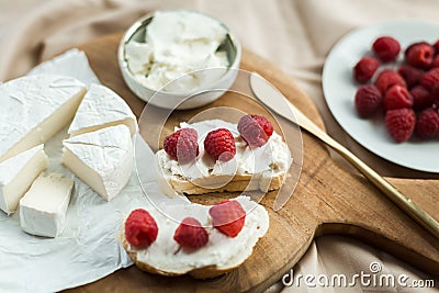 Aesthetic breakfast camembert, cream cheese and raspberries Stock Photo
