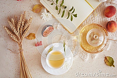 Aesthetic brunch of breakfast, cozy tea time, herbal tea and figs, peaches on the books. Sweet desserts, natural herbal Stock Photo