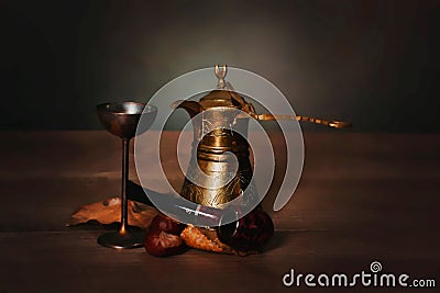 Aesthetic coffee still life view with a metal pot, glass and smoking pipe in closeup Stock Photo