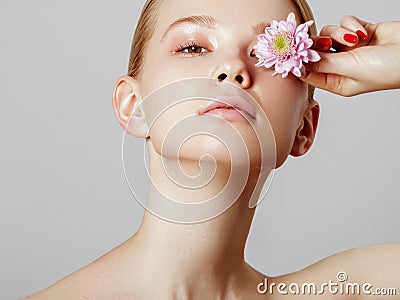 Aesthetic Cosmetology. Spring Woman. Beauty Summer model girl with colorful flowers . Beautiful Lady with Blooming Stock Photo