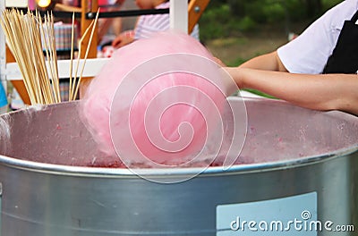 Woman preparing pink cotton candy Stock Photo