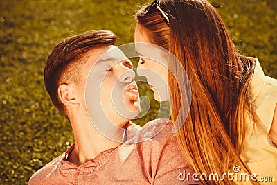 Affectionate couple on grass. Stock Photo