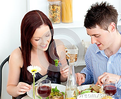 Affectionate couple having dinner at home Stock Photo