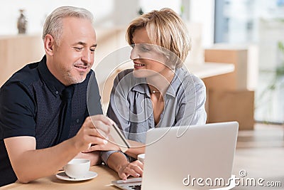 affectionate couple wanting to buy something online and pay Stock Photo