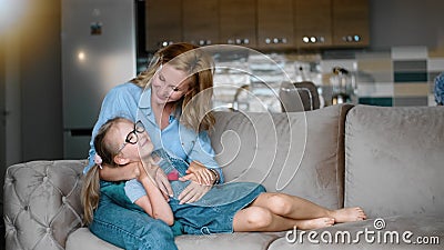 Affectionate Loving Mother and Kid Daughter on Sofa Kiss and Embrace Rbbro. Happy Joyful Family Stock Video - Video of affection, cheerful: 192178693-> 