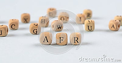 wooden cubes with the word AFR stand on a financial background, business concept Stock Photo