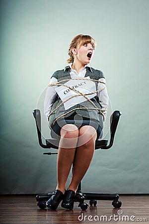Afraid businesswoman bound by contract terms. Stock Photo