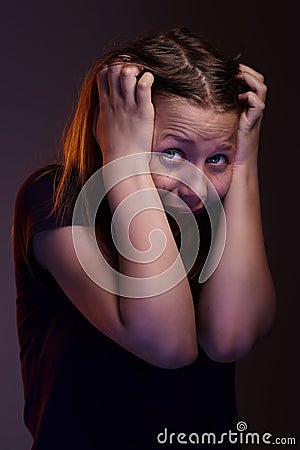 Afraid teen girl Stock Photo