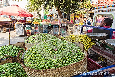 Miniature mangos for sale at an outdoor market Editorial Stock Photo