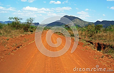 Stunning background landscape driving red dusty dirt roads of Africa Stock Photo