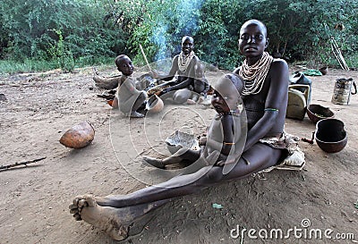 Africa, South Ethiopia.2009. Unidentified Karo mother and childern in their village in Mago National Park Editorial Stock Photo