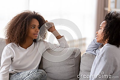 African mother and daughter chatting spending free time at home Stock Photo