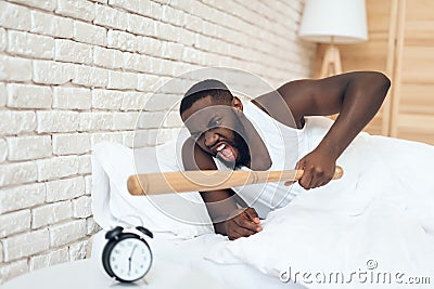 African American angry man threatens baseball bat Stock Photo