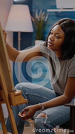 African american artist working on fine art creation Stock Photo