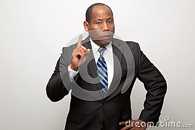 African American Business Man Pointing with Finger in Signal of Advice and Warning Stock Photo