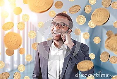 African American businessman, bitcoin rain Stock Photo