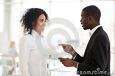 African American businessman promote excited female meeting in h Stock Photo