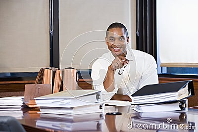 African American businessman reading documents Stock Photo