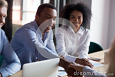 African American businessman shaking hand of business partner at meeting Stock Photo