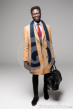 African american businessman travel with bag in coat isolated Stock Photo