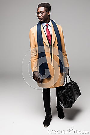 African american businessman travel with bag in coat isolated Stock Photo