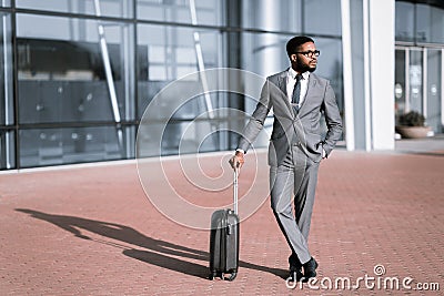 African American Businessman Traveler Standing With Suitcase Near Airport Outdoors Stock Photo