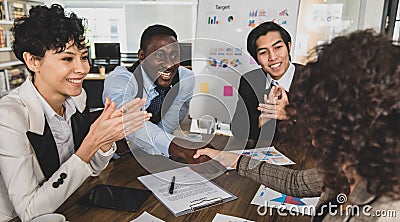 African american businessmen shake hands, young businesspeople represent business success. In the meeting room there is a good Stock Photo