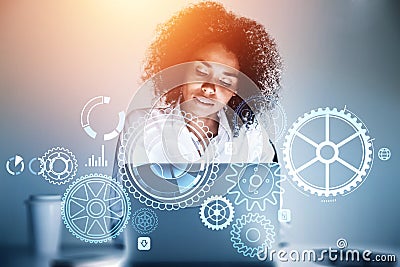 African American businesswoman wearing white shirt is typing on laptop Stock Photo