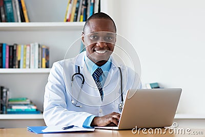 African american chef physician working at computer Stock Photo