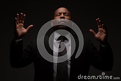 African American Christian Man Praying and Seeking Guidance from God Stock Photo