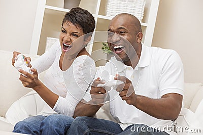 African American Couple Having Fun Playing Video Console Game Stock Photo